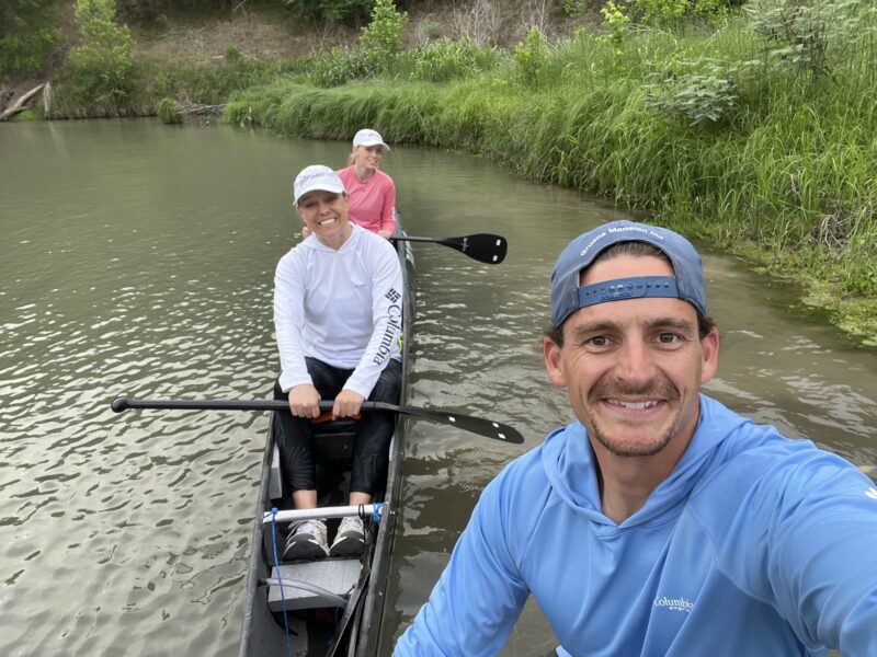 Spencer Fuller and family in canoe during race.