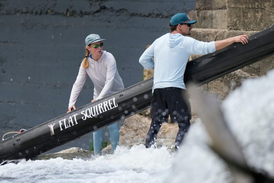 Spencer Fuller and daughter carrying the Flat Squirrel canoe around a dam portage during a Texas river race